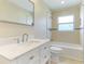 Bathroom with white vanity, bathtub, and shower at 678 Key Royale Dr, Holmes Beach, FL 34217