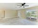 Spacious living area with large window and ceiling fan at 678 Key Royale Dr, Holmes Beach, FL 34217