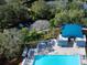 High-angle view of the community pool and surrounding landscape at 6828 Coyote Ridge Ct, University Park, FL 34201