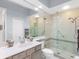 Updated bathroom with walk-in shower and modern vanity at 6828 Coyote Ridge Ct, University Park, FL 34201