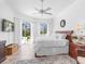 Spacious bedroom with king bed, pool view, and plenty of natural light at 6828 Coyote Ridge Ct, University Park, FL 34201