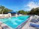 Inviting community pool with ample deck space and lounge chairs at 6828 Coyote Ridge Ct, University Park, FL 34201
