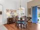 Elegant dining room with hardwood floors and a charming table setting at 6828 Coyote Ridge Ct, University Park, FL 34201