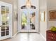 Bright entryway with double French doors opening to backyard at 6828 Coyote Ridge Ct, University Park, FL 34201