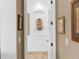 Hallway with decorative wall fountain and neutral color palette at 6828 Coyote Ridge Ct, University Park, FL 34201