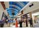Bright shopping mall interior with various shops and people at 6828 Coyote Ridge Ct, University Park, FL 34201