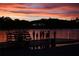 Silhouette of children fishing at sunset by the lake at 6828 Coyote Ridge Ct, University Park, FL 34201