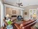 Living room with fireplace, hardwood floors, and comfortable seating at 6828 Coyote Ridge Ct, University Park, FL 34201