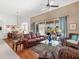 Spacious living room featuring hardwood floors and ample natural light at 6828 Coyote Ridge Ct, University Park, FL 34201