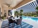 Covered patio with dining area and view of the pool at 6828 Coyote Ridge Ct, University Park, FL 34201