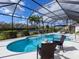 Inviting pool and spa with screened enclosure and outdoor seating at 6828 Coyote Ridge Ct, University Park, FL 34201