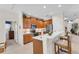 Eat-in kitchen with wood cabinets, stainless steel appliances, and breakfast bar at 8231 Stirling Falls Cir, Sarasota, FL 34243