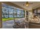 Relaxing screened patio overlooking a peaceful lake at 8231 Stirling Falls Cir, Sarasota, FL 34243