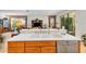 Island kitchen with double sink, wood cabinets, and stainless steel appliances at 8231 Stirling Falls Cir, Sarasota, FL 34243
