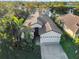 Aerial view of house showcasing a large backyard and canal views at 8231 Stirling Falls Cir, Sarasota, FL 34243