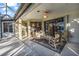 Covered patio with seating area overlooking a lake at 8231 Stirling Falls Cir, Sarasota, FL 34243