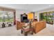 Living room with access to a patio and view of the lake at 8231 Stirling Falls Cir, Sarasota, FL 34243