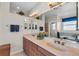 Elegant bathroom with double vanity, large mirror, and garden tub at 8231 Stirling Falls Cir, Sarasota, FL 34243