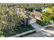 Aerial view of house showing canal-front location and landscaping at 8231 Stirling Falls Cir, Sarasota, FL 34243