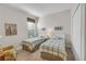 Bedroom with twin beds, each with plaid bedding at 8231 Stirling Falls Cir, Sarasota, FL 34243
