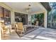 Relaxing screened patio with seating area, perfect for outdoor enjoyment at 8231 Stirling Falls Cir, Sarasota, FL 34243