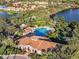 Aerial view of community pool with clubhouse and surrounding landscape at 8231 Stirling Falls Cir, Sarasota, FL 34243