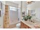 Bathroom with tub shower combo and wood vanity at 8231 Stirling Falls Cir, Sarasota, FL 34243