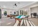 Relaxing game room with two billiard tables and comfortable seating at 8231 Stirling Falls Cir, Sarasota, FL 34243