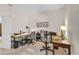 Home office with two desks, ample workspace, and built-in shelving at 8231 Stirling Falls Cir, Sarasota, FL 34243