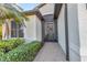 Welcoming front entry with brick walkway and screened porch at 8231 Stirling Falls Cir, Sarasota, FL 34243