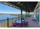 Outdoor patio with waterfront views and seating at 931 Tidewater Shores Loop # 931, Bradenton, FL 34208