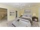 Main bedroom with king-size bed, walk-in closet, and stylish decor at 101 Gull Dr, Anna Maria, FL 34216