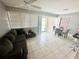 Cozy dining area with glass table, chairs, and view to the pool at 108 Shell Rd, Venice, FL 34293