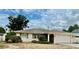 Single story home with attached garage, landscaping, and a spacious front yard at 108 Shell Rd, Venice, FL 34293