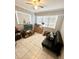 Cozy Gathering room with a fold-out couch and tiled floors at 108 Shell Rd, Venice, FL 34293