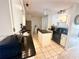 Modern kitchen with granite countertops, stainless steel appliances, and ample cabinet space at 108 Shell Rd, Venice, FL 34293