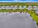 Aerial view of homes and lake in a residential community at 12496 Palatka Dr, Venice, FL 34293