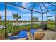 Lake view from a relaxing screened patio at 12496 Palatka Dr, Venice, FL 34293