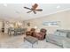 Open living room with seating area and view into dining area at 13711 Messina Loop # 102, Bradenton, FL 34211