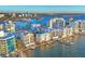 Aerial perspective of waterfront buildings and boats on a sunny day at 166 Golden Gate Pt # 70, Sarasota, FL 34236