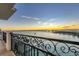 Breathtaking sunset view from private balcony overlooking the water at 166 Golden Gate Pt # 70, Sarasota, FL 34236