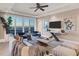 Living room showcasing sunset views and stylish decor at 166 Golden Gate Pt # 70, Sarasota, FL 34236