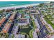 Aerial view of community with pool, canal, and beach access at 1801 Gulf N Dr # 222, Bradenton Beach, FL 34217