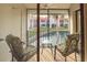 Relaxing balcony overlooking a canal with patio furniture at 1801 Gulf N Dr # 222, Bradenton Beach, FL 34217