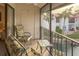 Screened balcony with outdoor seating and tranquil water views at 1801 Gulf N Dr # 222, Bradenton Beach, FL 34217