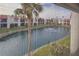 View of a peaceful canal from a screened window at 1801 Gulf N Dr # 222, Bradenton Beach, FL 34217