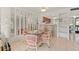 Bright dining area with glass-top table and wicker chairs at 1801 Gulf N Dr # 222, Bradenton Beach, FL 34217