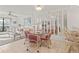 Charming dining area with glass-top table and wicker chairs at 1801 Gulf N Dr # 222, Bradenton Beach, FL 34217