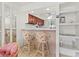 Bright kitchen features wood cabinets and a breakfast bar with seating at 1801 Gulf N Dr # 222, Bradenton Beach, FL 34217