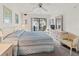 King-size bed and private balcony in this main bedroom at 1801 Gulf N Dr # 222, Bradenton Beach, FL 34217